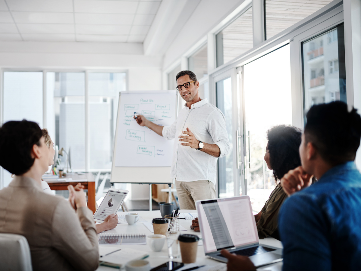 Man demonstrating leadership communication in a presentation
