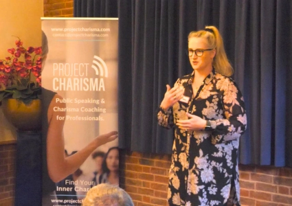 Woman practising public speaking skills and leadership presence during Project Charisma’s corporate leadership training course